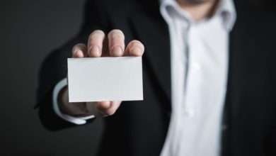 Person Holding a Blank Business Card